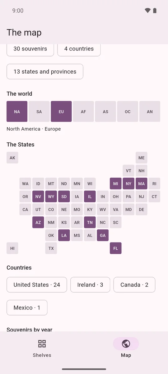 The map screen: continents and US states filled in violet where souvenirs came from, with country counts
